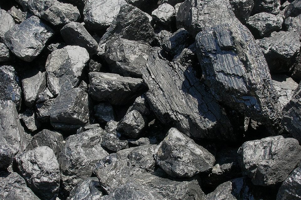 Heap of coal lumps with glossy black faces